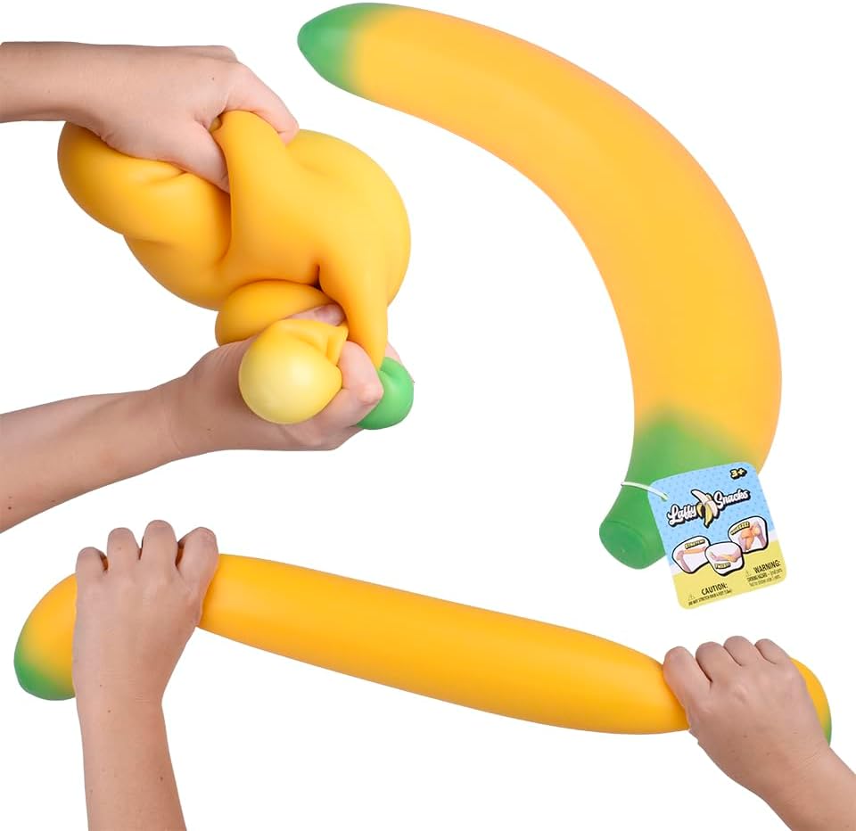 Toymendous Laffy Snacks Squishy Banana, a long yellow banana with a green tip, shown knotted inside one fist and pulled straight between two hands